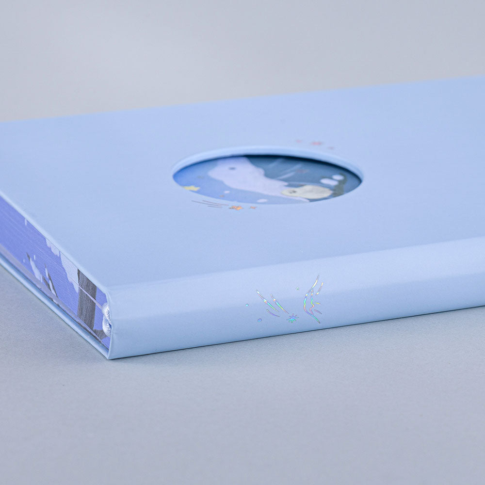 Close up of Tsuki Four Seasons Winter Collector’s Edition Bullet Journal in light blue background