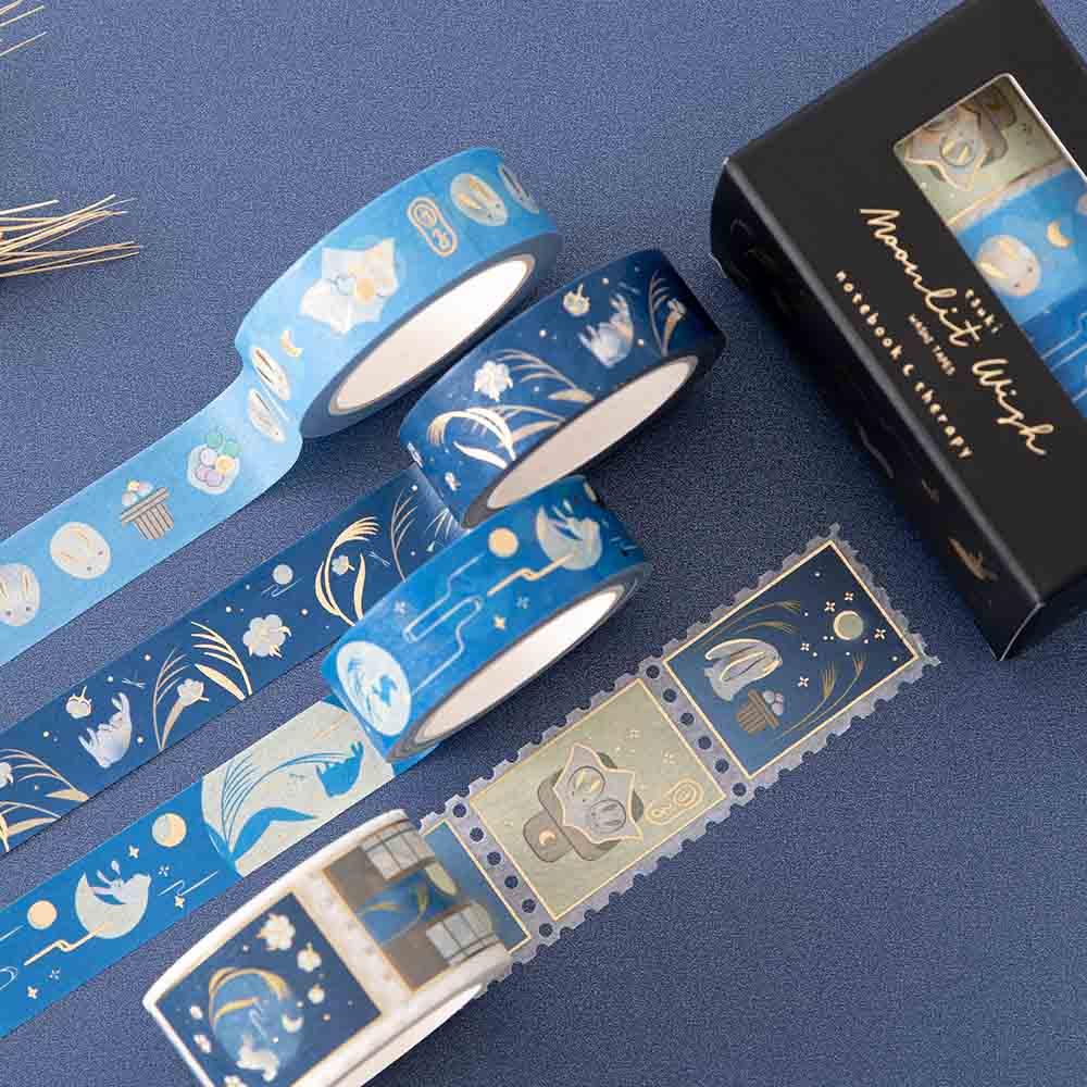 Tsuki ‘Moonlit Wish’ Washi Tape Set rolled out on dark blue background