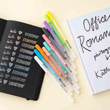 Gelly Roll Pens with open Tsuki Black Paper Limited Edition Hardcover Bullet Journal and book on buttermilk background