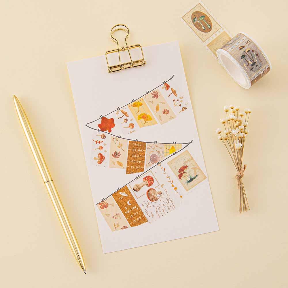 Tsuki ‘Maple Dreams’ Washi Tapes on bright white clipboard with gold pen and dried flowers on cream background