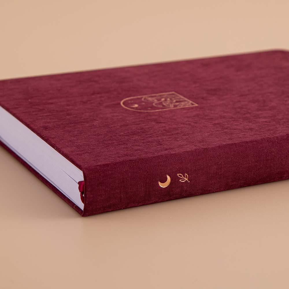 Spine of Tsuki ‘Kinoko’ Limited Edition Bullet Journal on beige background