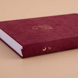 Spine of Tsuki ‘Kinoko’ Limited Edition Bullet Journal on beige background