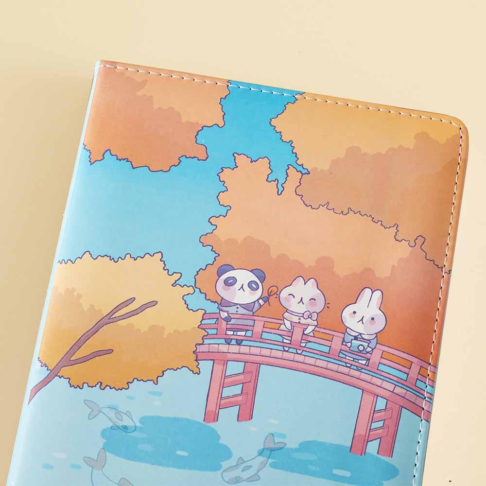 Close up of Tsuki ‘Four Seasons: Autumn Edition’ Bullet Journal made with milkkoyo on light brown background