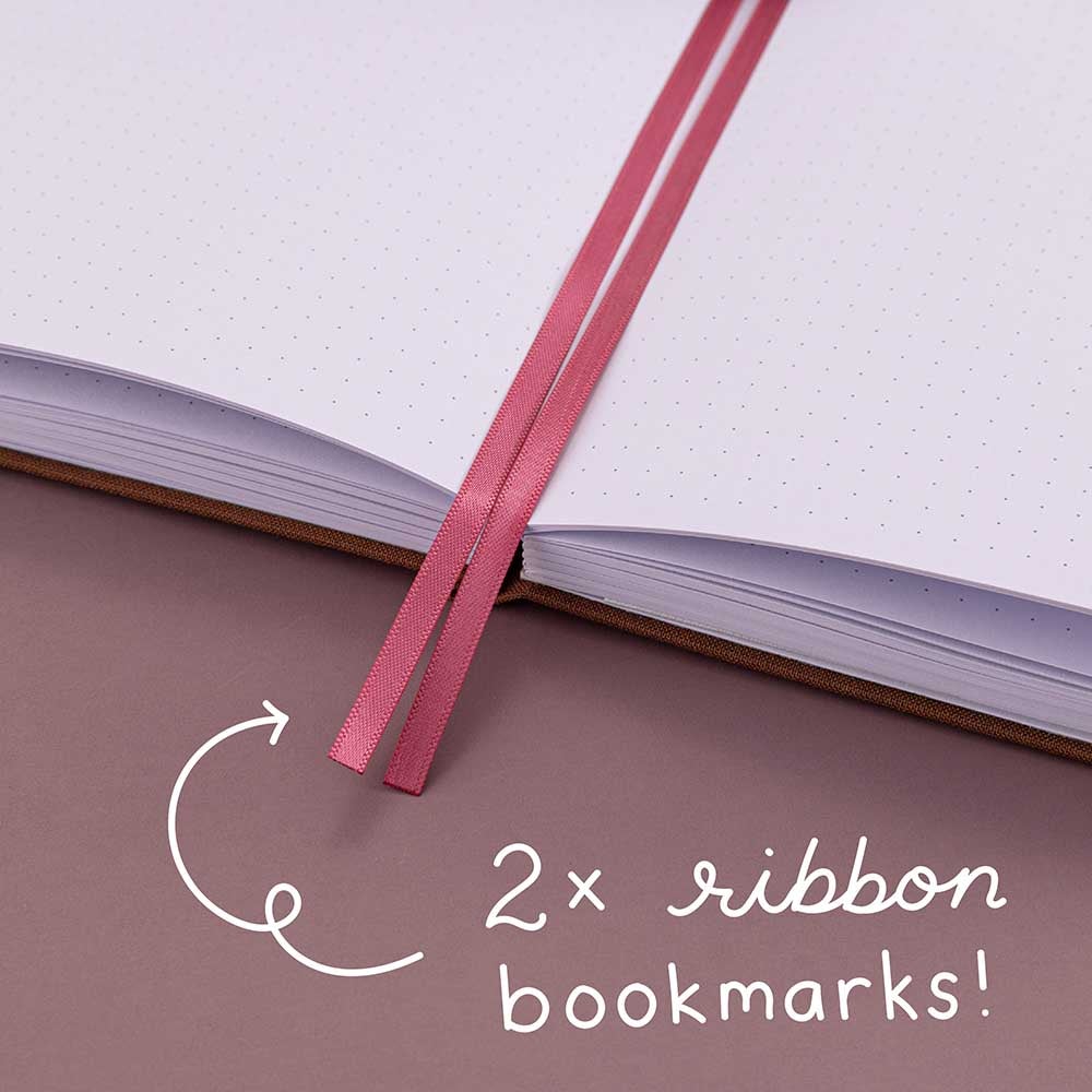 Close up of Tsuki ‘Vintage Rose’ Limited Edition Bullet Journal with two bookmark ribbons on mauve background