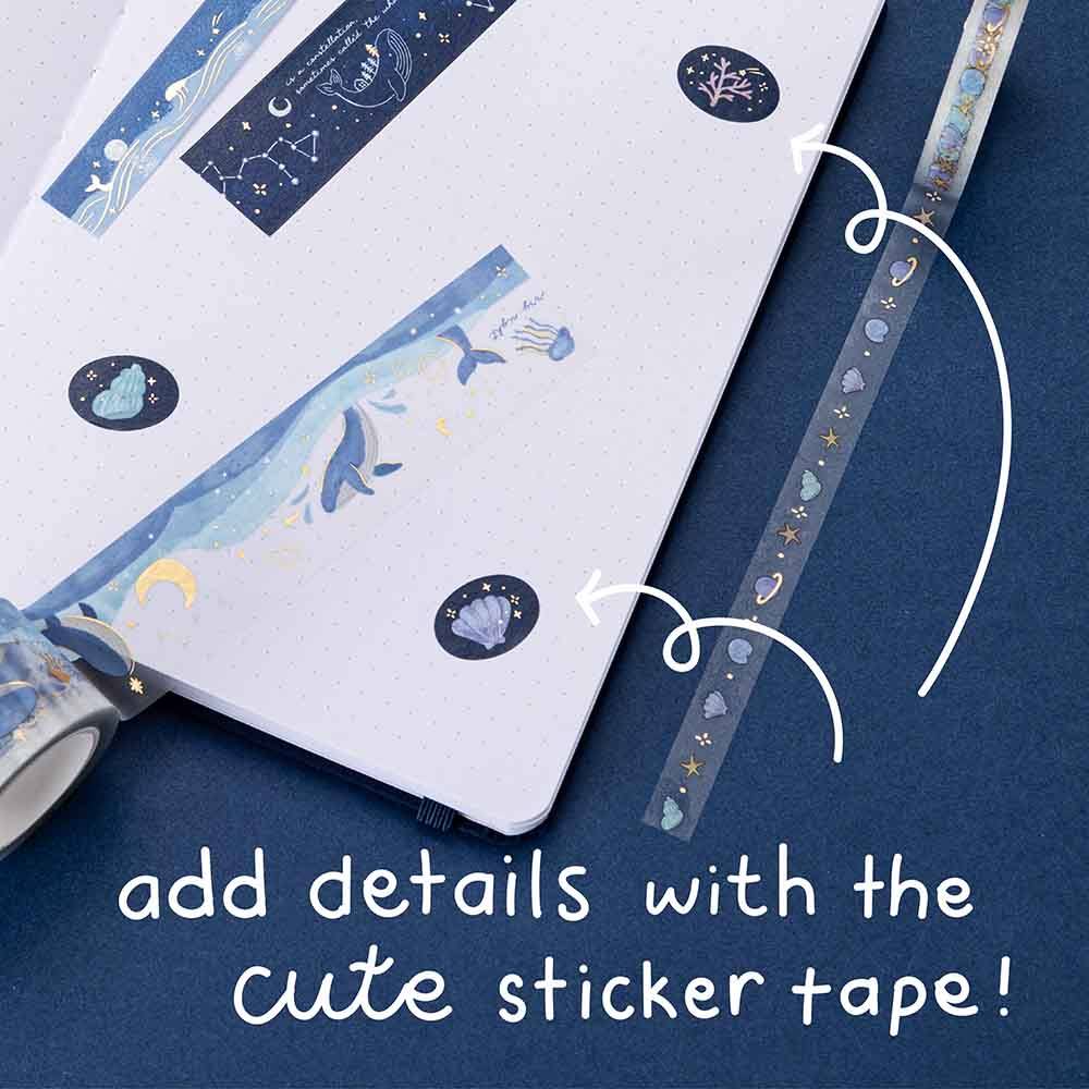 Some washi tapes and circle stickers on dot grid bullet journal with the words ‘add details with the cute sticker tape!’ written in white