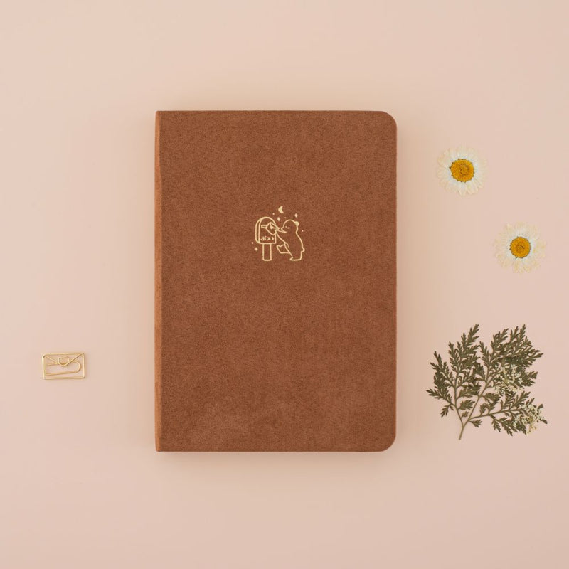 Tsuki Kuma brown velvet bear bullet journal with circle graphic showing kraft paper page