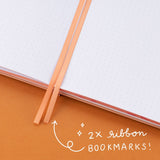 Close up of 2x ribbon bookmarks of the Tsuki Four Seasons: Autumn Collector’s Edition 2022 Bullet Journal