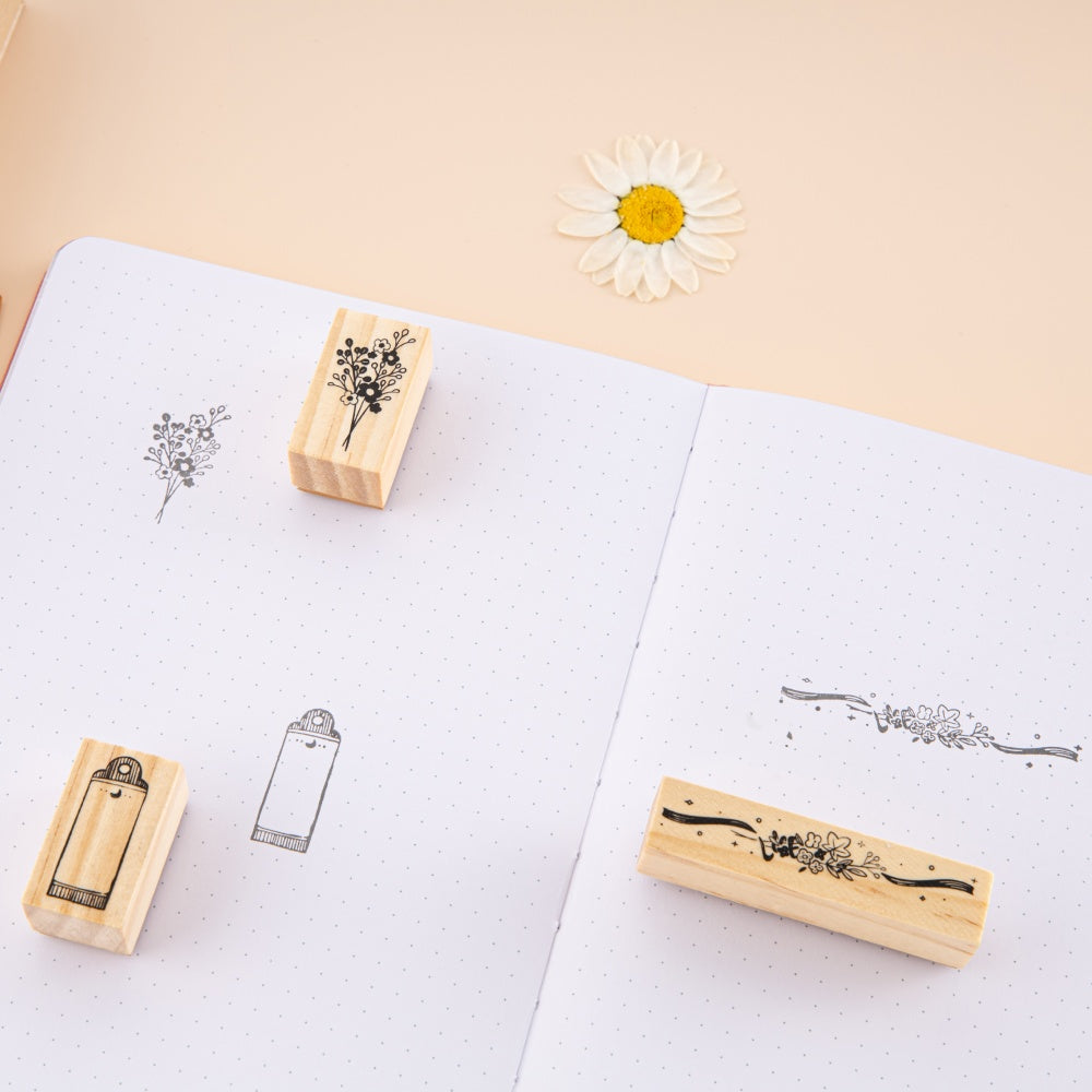 Stamp swatch on bullet journal with stamps around it