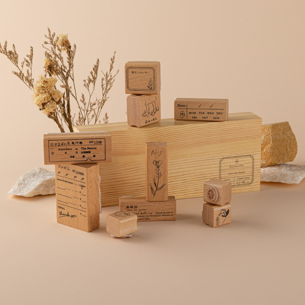 Styled photo of stamp box with stamps on top and around it