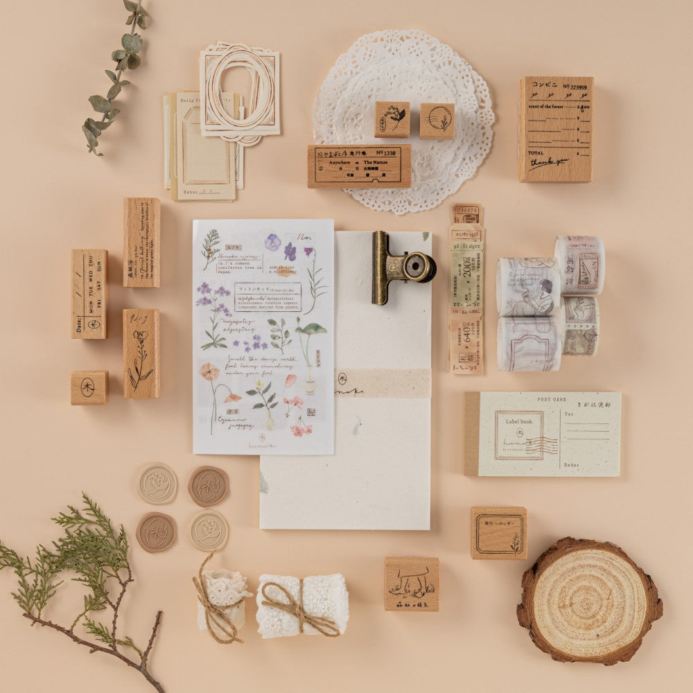 Flatlay of scrapbook set with washi tapes and stamps