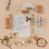 Flatlay of scrapbook set with washi tapes and stamps