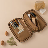Opened pencil case with pens, train tickets, stamps and eraser