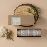 Hinoki Into the Forest PET + Washi Tape set opened box with the lid resting on a wood slice with a rock and pine leaves as decoration