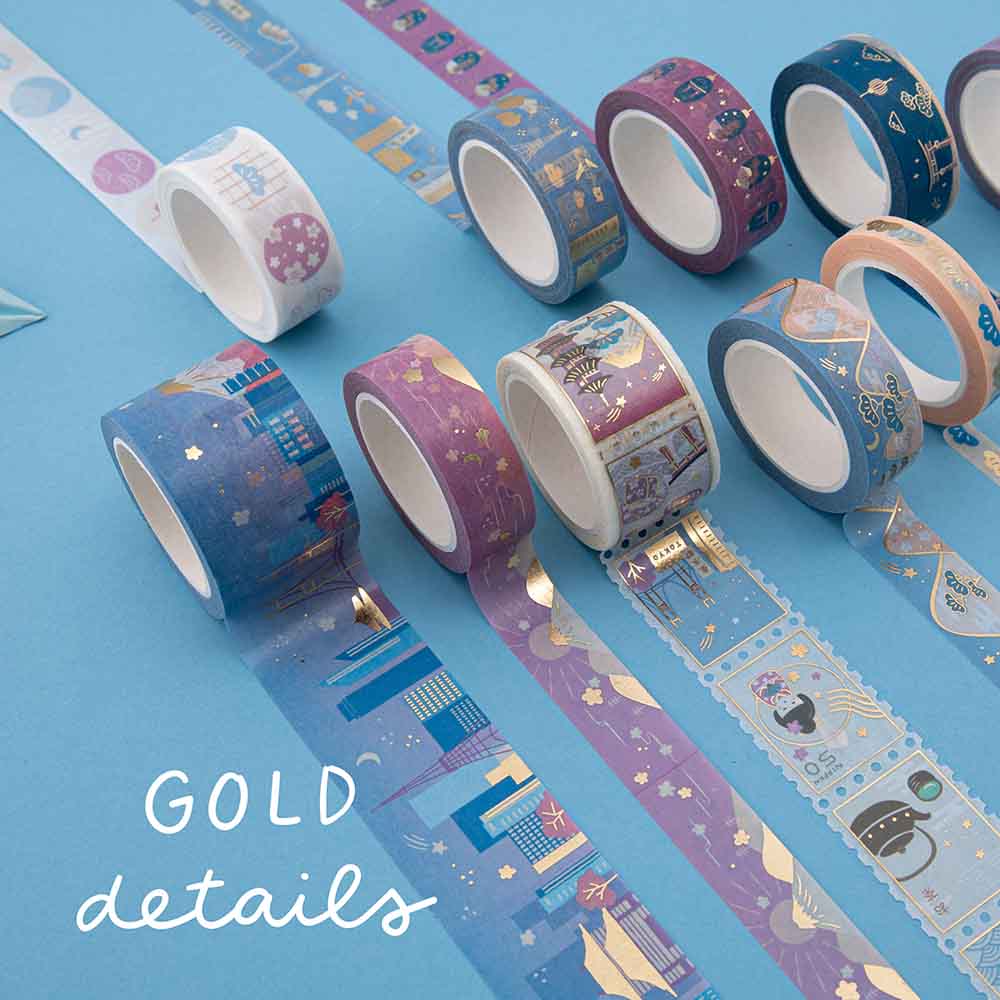Close up of Tsuki Sights of Japan washi tape rolls showing gold details on blue background